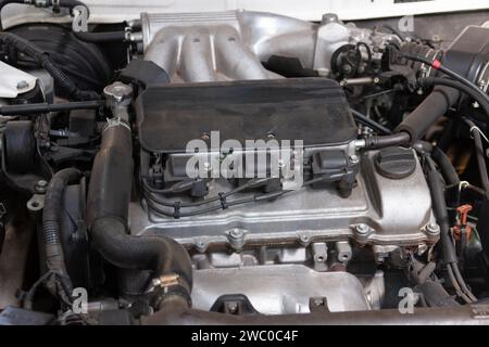 car engine under the hood, top view, six cylinders in V formation Stock Photo