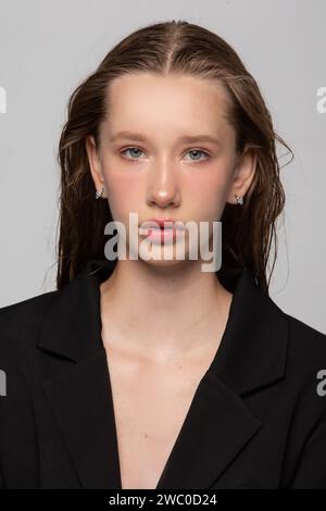 Portrait of a beautiful blonde girl with blue eyes and clear skin. A seventeen year old girl. Slavic appearance of a young beauty. Stock Photo