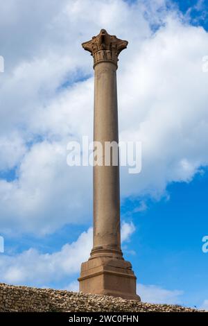 Giant ancient Pompey's pillar on territory of Serapeum of Alexandria in Egypt Stock Photo