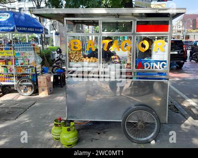 Indonesian Street Food Cart or Gerobak, a traditional push cart in Bandung, West Java, Indonesia selling Batagor. Stock Photo