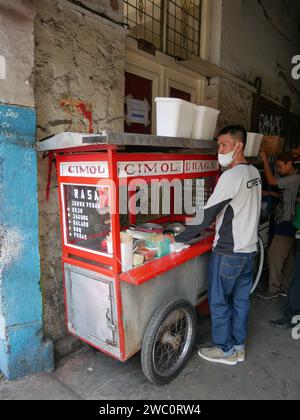 Indonesian Street Food Cart or Gerobak, a traditional push cart in Bandung, West Java, Indonesia selling Cimol. Stock Photo