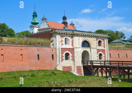 Fortifications of the fortress and city of Zamosc. View on the walls of fortress and Szczebrzeska Gate, Zamosc. Poland. Stock Photo