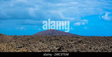 Spectacular view of the Fire Mountains at Timanfaya National Park, this unique area consisting entirely of volcanic soils. Copy space.Lanzarote, Spain Stock Photo