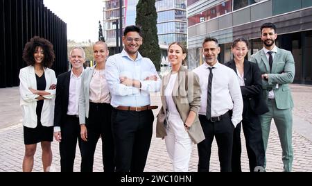 Team portrait diverse happy professional posing confidence. Young and mature multiracial colleagues. Stock Photo