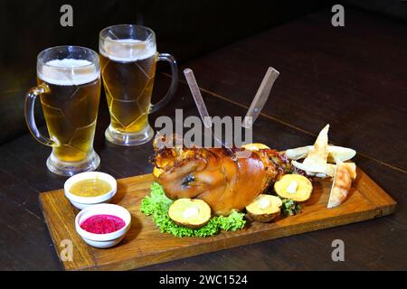Baked pork leg. Pork knuckle baked in the oven. Shank for beer. Stock Photo