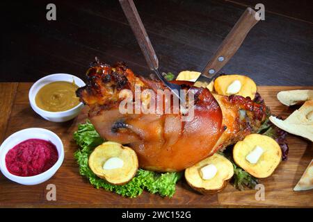 Baked pork leg. Pork knuckle baked in the oven. Shank for beer. Stock Photo