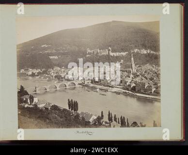 View of Heidelberg over the Neckar, Anonymous, c. 1870 - c. 1900 photograph Part of photo album with recordings of sights in Europe, Trinidad, Haiti, Martinique and Suriname. Heidelberg photographic support albumen print prospect of city, town panorama, silhouette of city. bridge in city across river, canal, etc. Heidelberg. Neckar Stock Photo