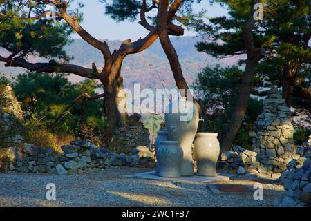 Sangju City, South Korea - November 18th, 2023: Atop the hill where Gyeongcheondae Observatory stands, a stone water fountain is softly illuminated, w Stock Photo