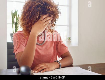 Headache, paperwork or secretary in office for administration, documents report or project deadline. Migraine pain, stress or frustrated woman at desk Stock Photo