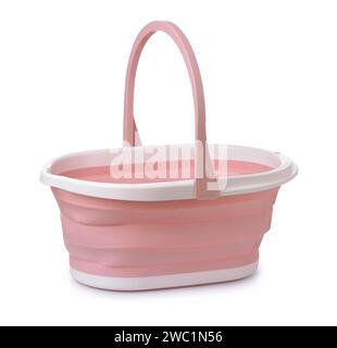 Empty pink collapsible silicone bucket with handle isolated on white Stock Photo
