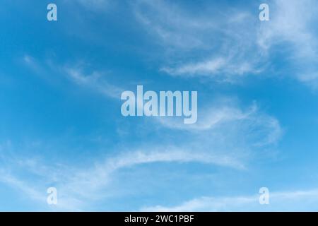 Beautiful blue sky with strange shape of clouds in the morning or evening is used as natural background texture in decorative art work Stock Photo