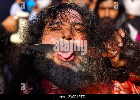 India. 12th Jan, 2024. Indian Muslim Sufi devotee use sharp objects to self-flagellate in a procession during the Urs festival at the shrine of Sufi saint Khwaja Moinuddin Chishti in Ajmer, Rajasthan, India, on 12 January 2024. Thousands of Sufi devotees from different parts of India travel to the shrine for the annual festival, marking the death anniversary of the saint. Photo by ABACAPRESS.COM Credit: Abaca Press/Alamy Live News Stock Photo