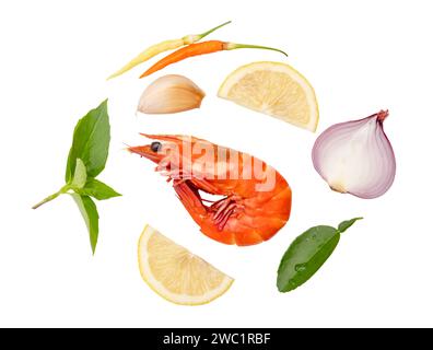 Single red cooked prawn or shrimp with spice or seasoning in set prepared for Thai prawn soup is isolated on white background with clipping path. Stock Photo
