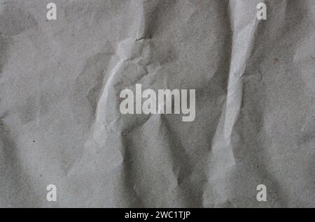 Background from used crumpled gray wrapping paper. Stock Photo