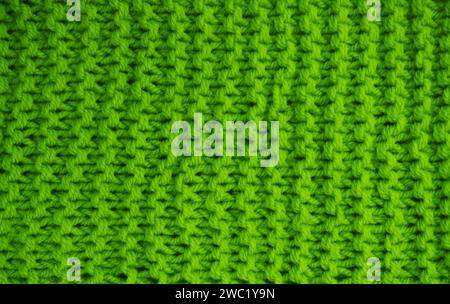 Crochet texture of woolen fabric close-up. Abstract background of blue knitted woolen threads close-up... Stock Photo