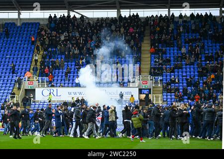 Reading, UK, 13th January 2024. The EFL League One match between Reading and Port Vale is abandoned on 16 minutes as fans invade the pitch, protesting against the Reading Owners. Credit: TeeGeePix/Alamy Live News Stock Photo