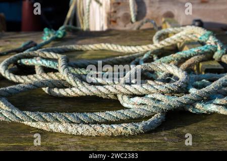 Old rope for tying up boats on Portmagee Quayside, Ireland Stock Photo