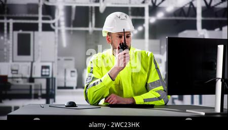 Engineer Using PC In Automated Semiconductor Assembly Line Stock Photo