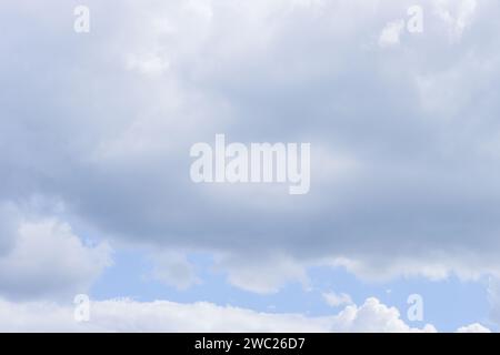 Overcast sky. Solid large light gray clouds. Stock Photo