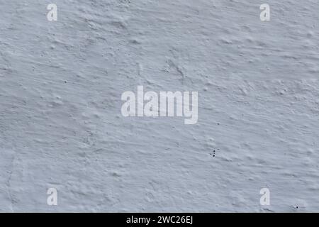 Texture of old uneven gray plaster. Stock Photo