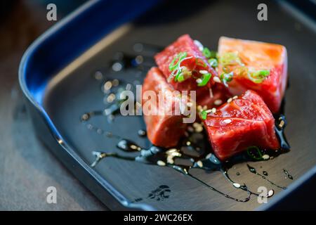 Premium Japanese wagyu diced beef cubes sliced on plate, meat concept Stock Photo
