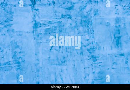 The surface is made of old unevenly applied blue plaster. copy space, place for text, Stock Photo