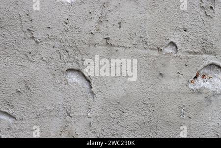 Abstract background from a wall covered with gray plaster. Stock Photo
