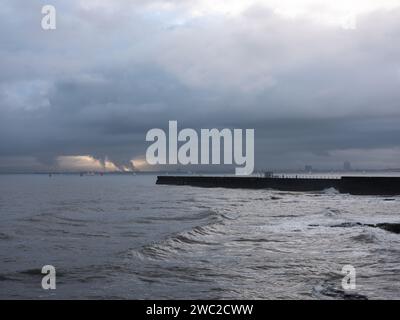 The Heugh pier at Hartlepool headland with a view of Teesside in the distance. Stock Photo
