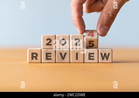 2023 business and customer review for business strategic planning in the next year 2024. Flipping of 2023 to 2024 on wooden blocks. End of the year Stock Photo