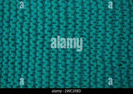Abstract background of blue knitted woolen threads close-up... Stock Photo