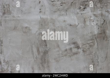 Cement wall covered with plaster. Stock Photo