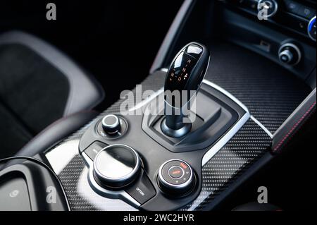 A close-up shot of a modern car's manual button on a sunny day Stock Photo