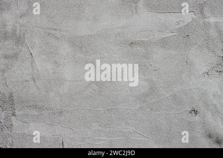 Textured grey putty. the background texture of Venetian plaster as a patterned wall. Stock Photo
