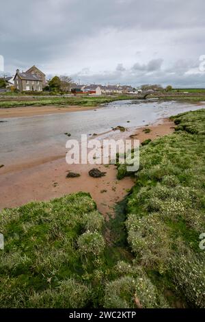 The village of Aberffraw on the west coast of Anglesey, North Wales. Houses beside the Afon Ffraw. Stock Photo
