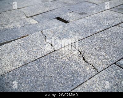 Cracked new granite paving slab Stock Photo