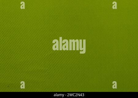 The surface of the fabric is green in close-up. soft natural textile texture. Stock Photo