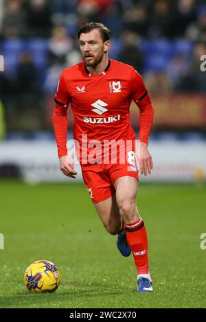 Birkenhead, UK. 13th Jan, 2024. Alex Gilbey of Milton Keynes Dons in action. EFL Skybet Football league two match, Tranmere Rovers v MK Dons at Prenton Park, Birkenhead, Wirral on Saturday 13th January 2024. this image may only be used for Editorial purposes. Editorial use only, .pic by Chris Stading/ Credit: Andrew Orchard sports photography/Alamy Live News Stock Photo