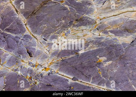 Coloured, ferrous mineral rocks on the beach of Topinetti, near Rio ...