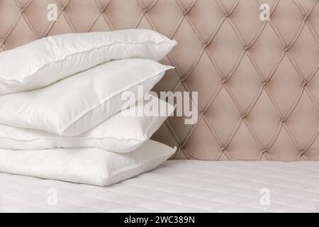 Soft comfortable white pillows on a bed Stock Photo