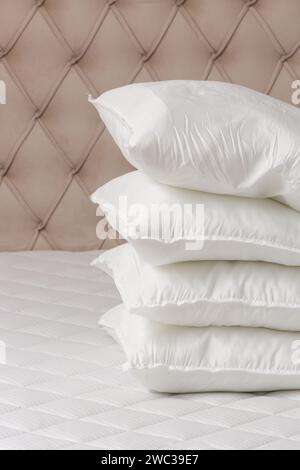 Soft comfortable white pillows on a bed Stock Photo