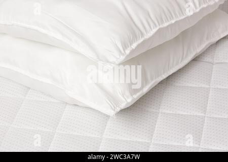 Soft comfortable white pillows on a bed Stock Photo