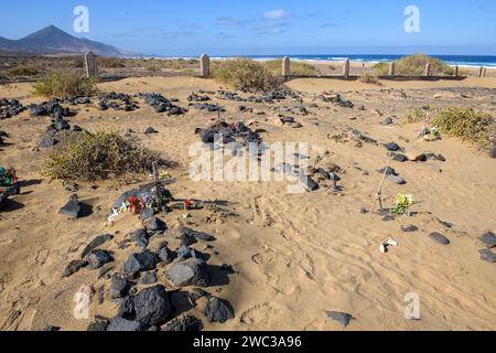 View of old sandy historical cemetery from 1950s with several graves marked by stones from abandoned village of Cofete on west coast of Jandia Stock Photo