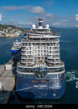 Passengers on the stern of Mein Schiff 1 as it is moored in Alesund, Norway just prior to sail away. Stock Photo