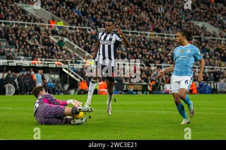 13th January 2024; St James' Park, Newcastle, England; Premier League Football, Newcastle United versus Manchester City; Stefan Ortega Moreno of Manchester City dives at the feet of Alexander Isak of Newcastle United to make the save Stock Photo