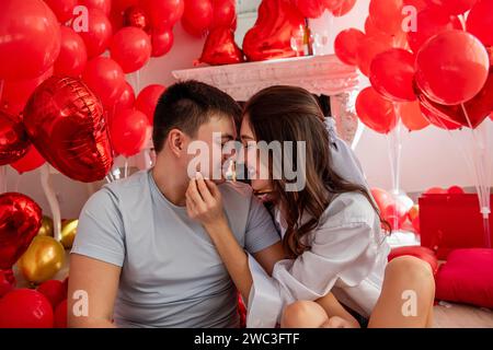 Close up portrait of intimate moment between young man and woman. Affection deep connection between couple. Woman facing man with tender expression, h Stock Photo