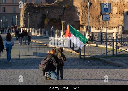 Rome, Italy. 13th Jan, 2024. Mum with her son with palestinian flag in via dei Fori Imperiali in Rome (Photo by Matteo Nardone/Pacific Press) Credit: Pacific Press Media Production Corp./Alamy Live News Stock Photo