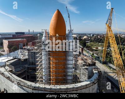 Los Angeles, USA. 13th Jan, 2024. A giant orange fuel tank and two twin solid rocket boosters for the Space Shuttle display at the California Science Center are now in place. The Shuttle Endeavour will be placed upon the orange tank later this month, and the building will be eventually enclosed. 1/13/2024 Los Angeles, CA., USA (Photo by Ted Soqui/Sipa USA) Credit: Sipa USA/Alamy Live News Stock Photo