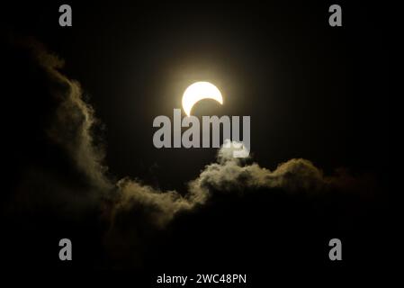 Partial Solar Eclipse of October 14, 2023 during sunset as seen from Natal, a city in Brazil Stock Photo