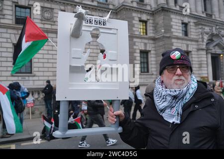 London, UK. 13th January, 2024. Thousands of pro-Palestinian protesters marched from the City of London to Parliament Square, calling for an immediate ceasefire. Despite mass protests globally, and the seventh national march, shows no sign of happening soon as the Palestinian death toll rises to 23,000 and thousands more are injured, facing dire conditions inside the few functioning medical facilities. Credit: Eleventh Hour Photography/Alamy Live News Stock Photo