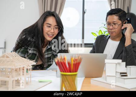 Architects women and engineer working on construction site. Stock Photo